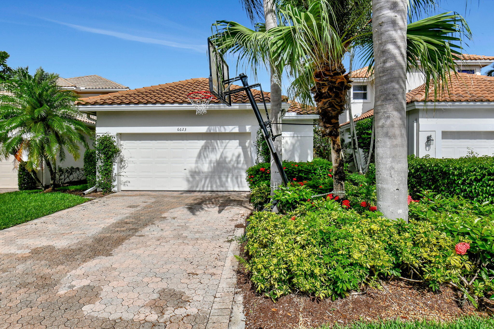 6623 Northwest 25th Avenue Boca Raton, FL 33496 - Photo 2 of 37 a front view of house with small garden