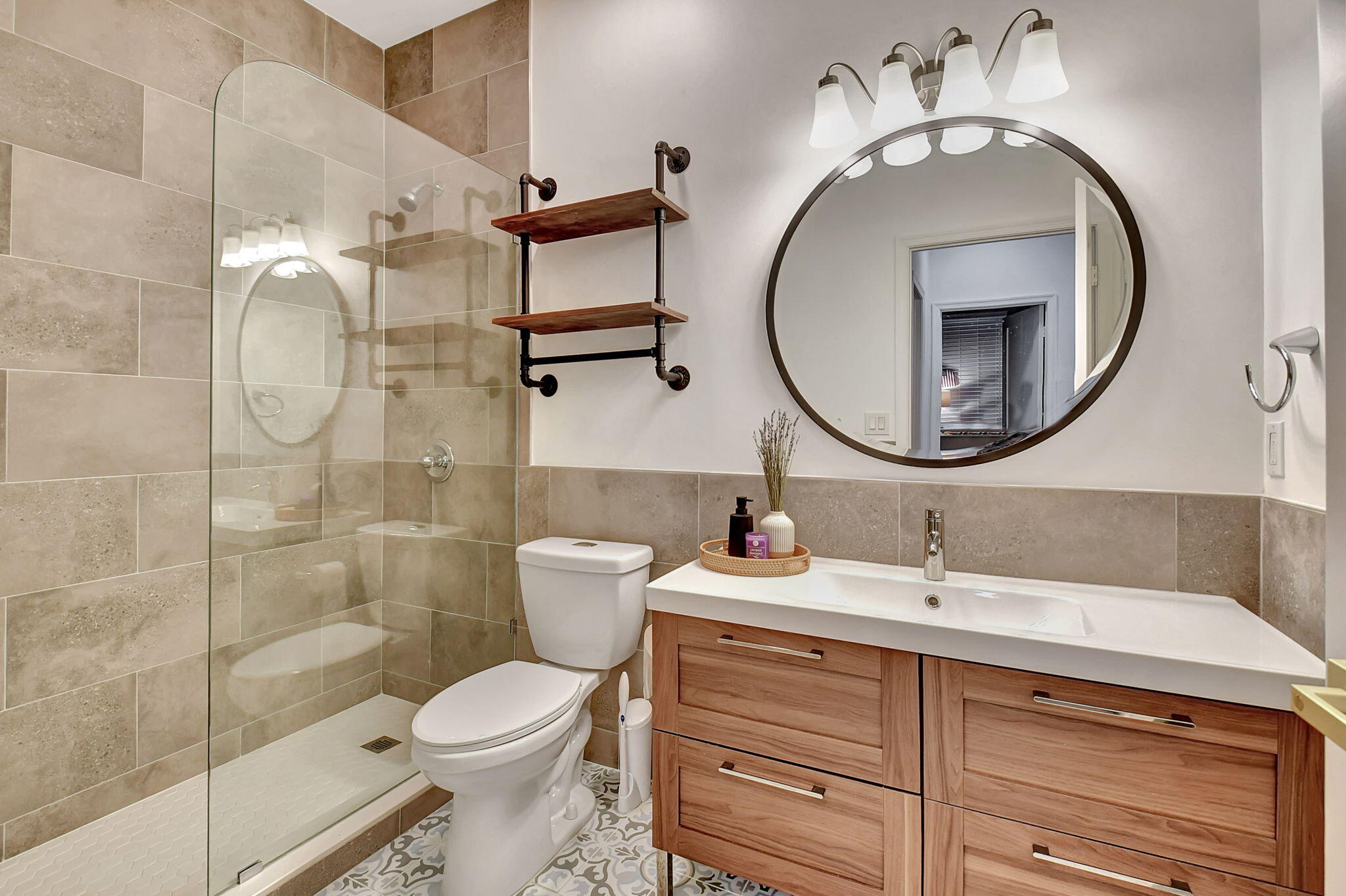 6623 Northwest 25th Avenue Boca Raton, FL 33496 - Photo 23 of 37 a bathroom with a sink a toilet and a mirror
