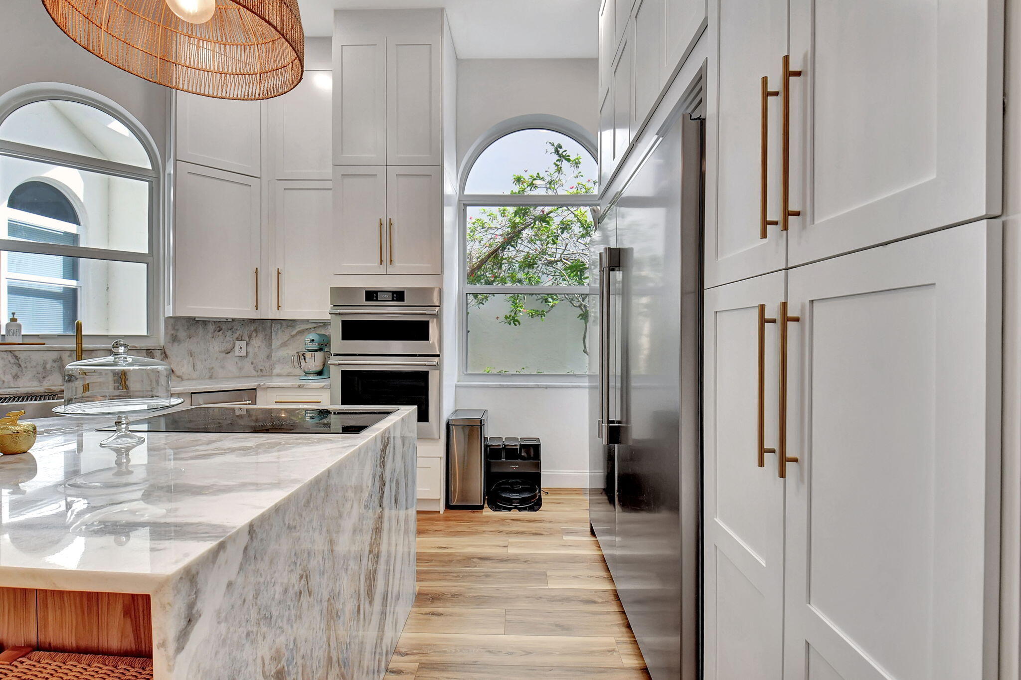 6623 Northwest 25th Avenue Boca Raton, FL 33496 - Photo 6 of 37 a kitchen with stainless steel appliances granite countertop a refrigerator and a stove top oven