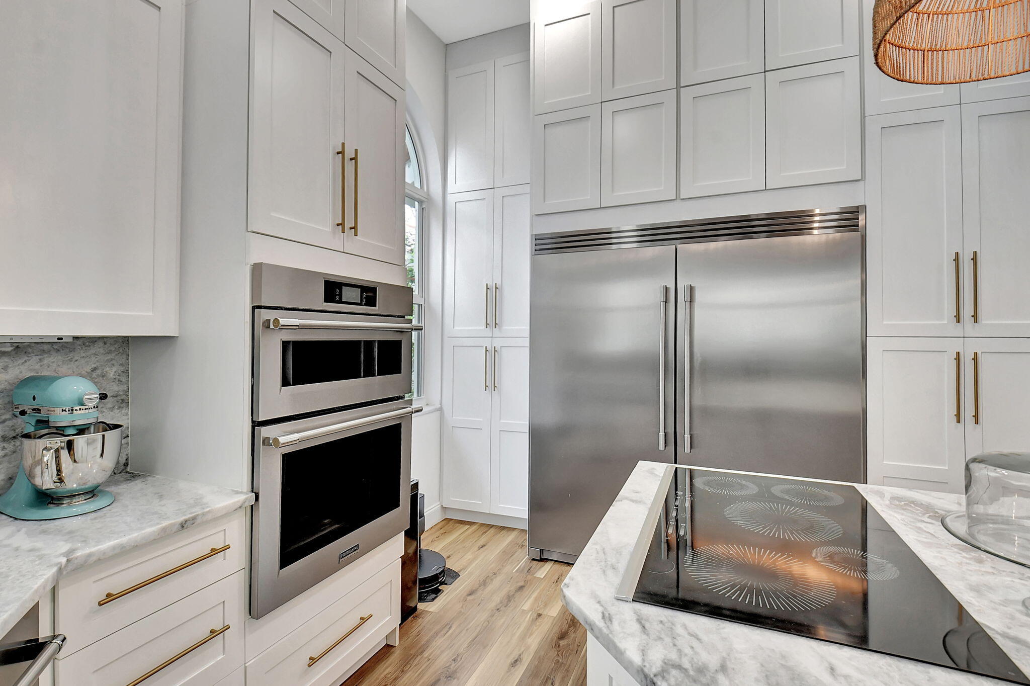 6623 Northwest 25th Avenue Boca Raton, FL 33496 - Photo 8 of 37 a kitchen with granite countertop white cabinets and stainless steel appliances