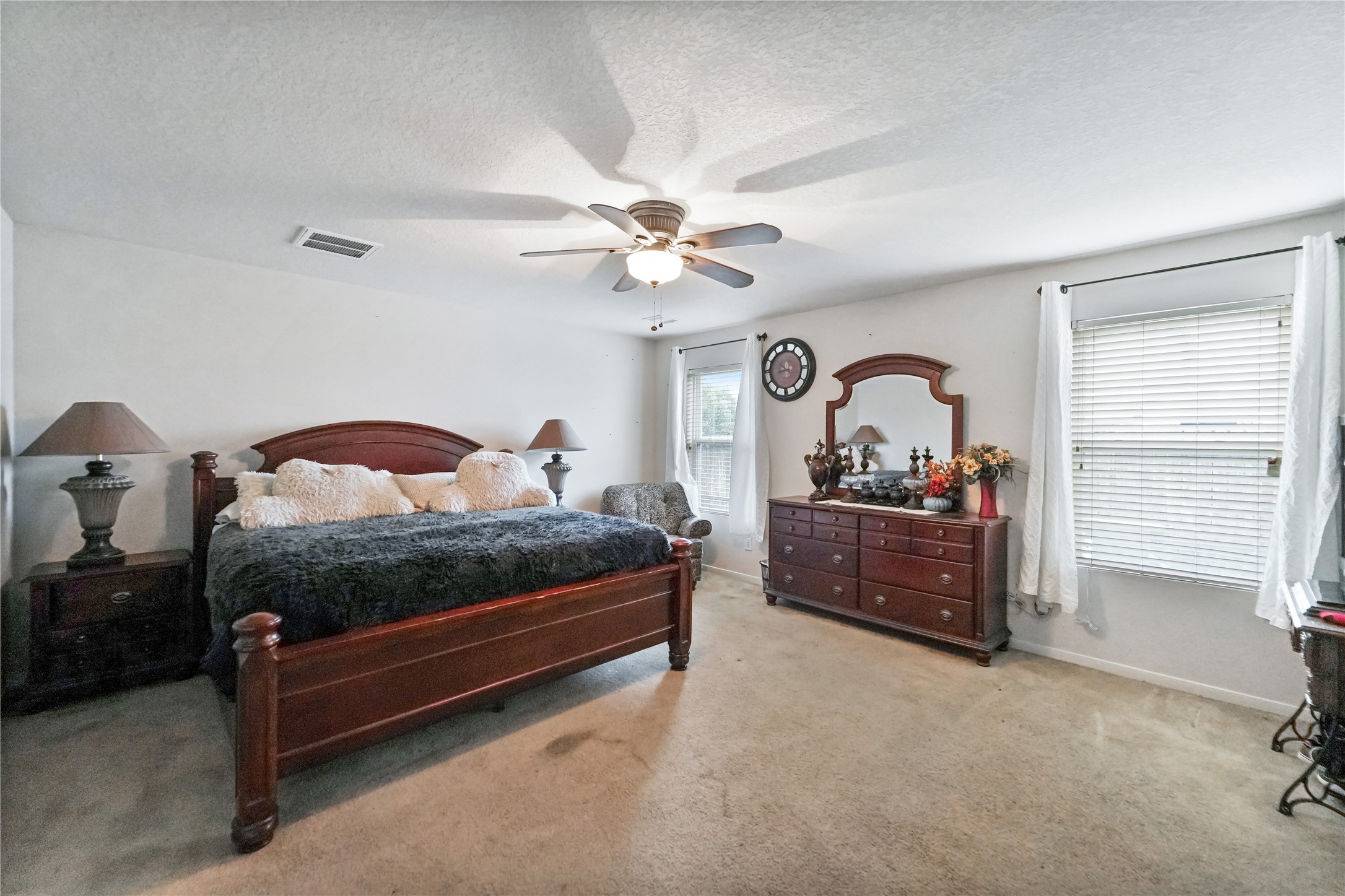 8011 Sumal Circle Baytown, TX 77521 - Photo 15 of 37 a bedroom with a bed and a chandelier