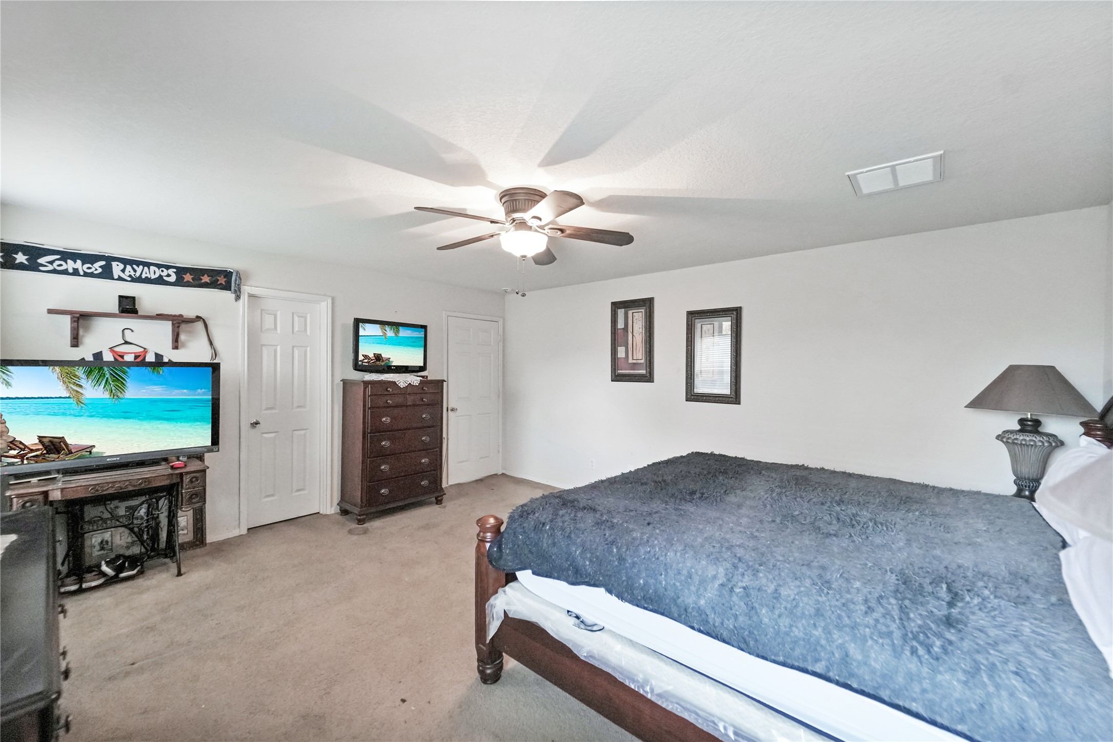 8011 Sumal Circle Baytown, TX 77521 - Photo 16 of 37 a living room with furniture and a flat screen tv