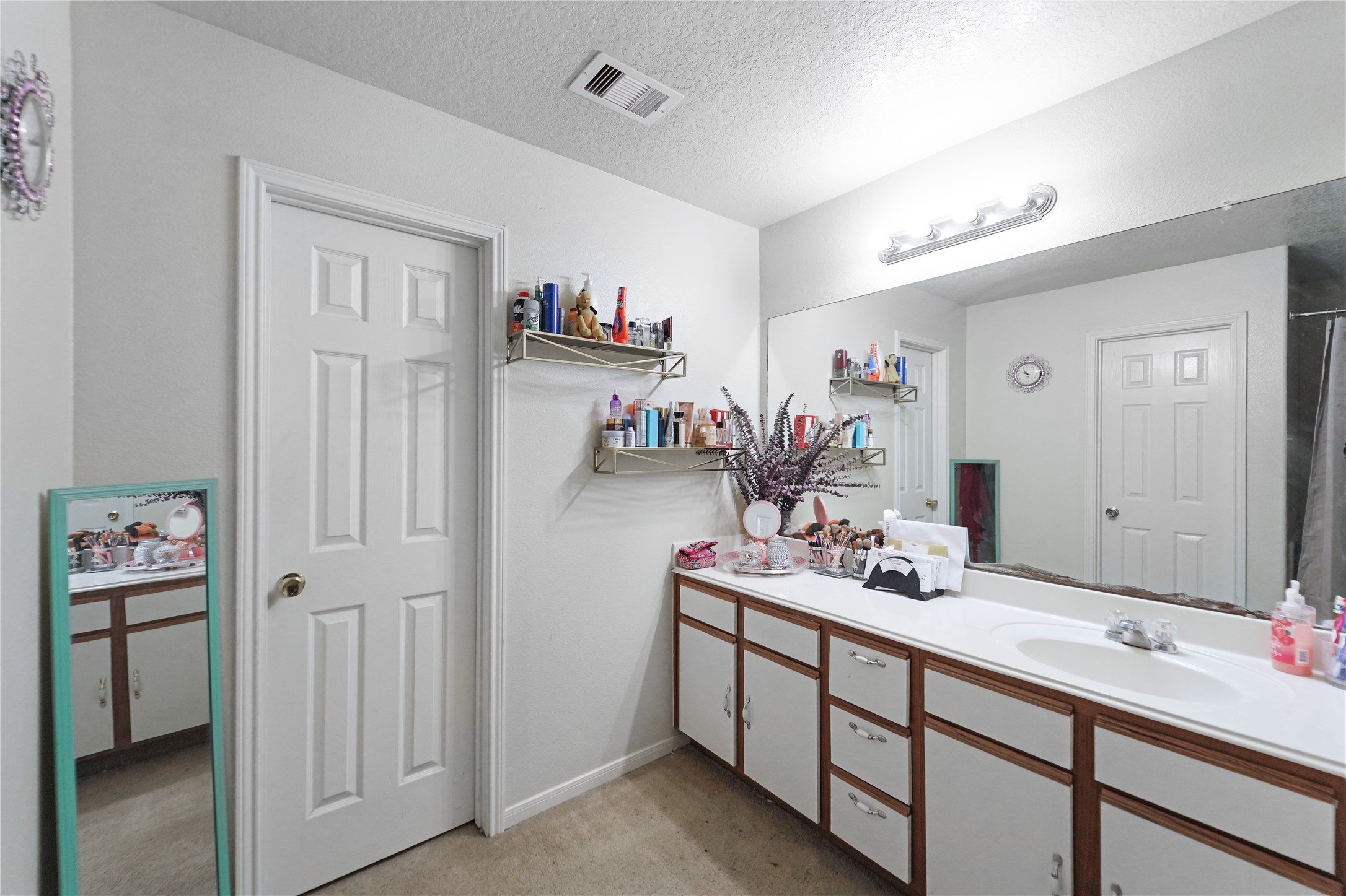 8011 Sumal Circle Baytown, TX 77521 - Photo 18 of 37 a bathroom with a double vanity sink mirror and bathtub