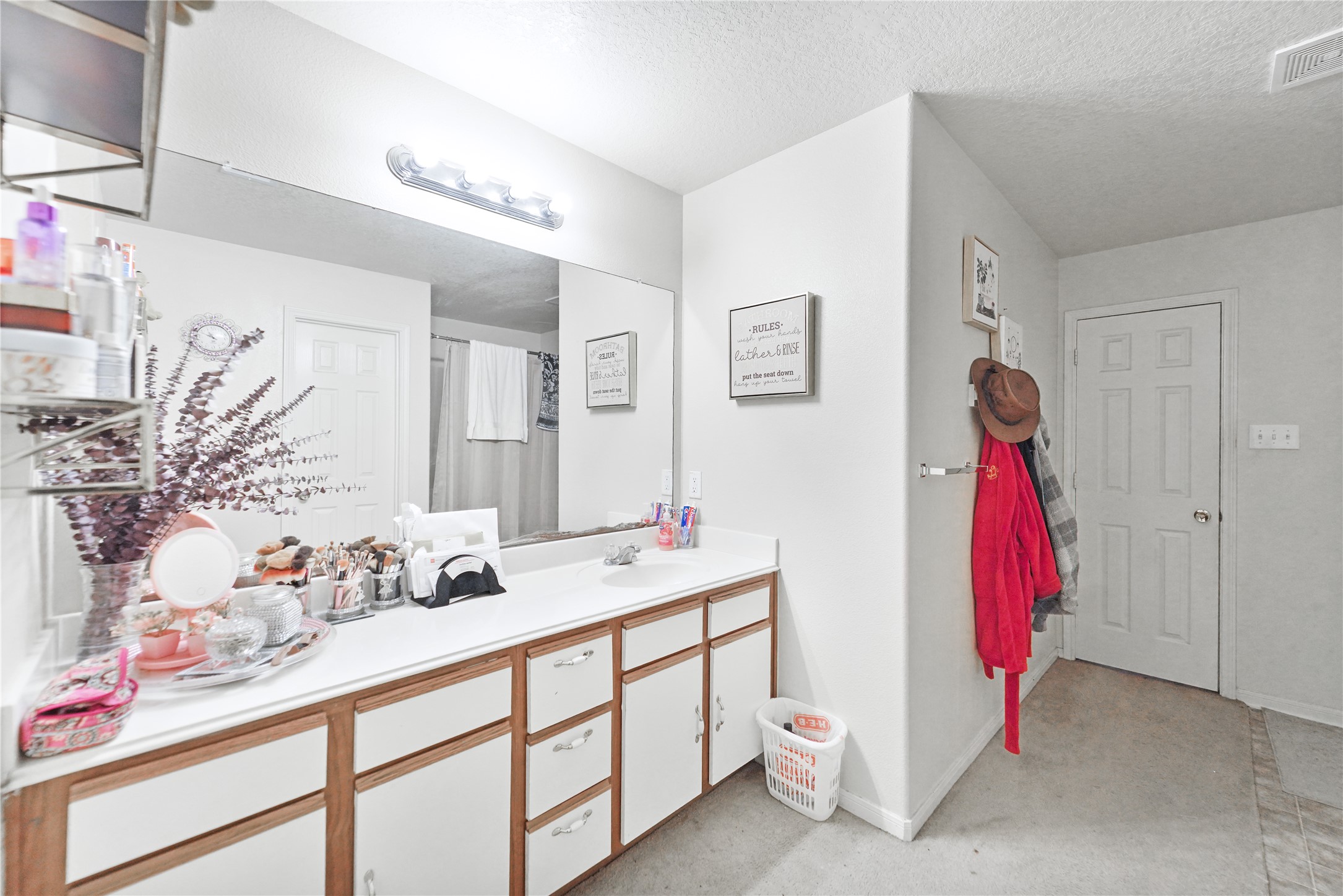 8011 Sumal Circle Baytown, TX 77521 - Photo 19 of 37 a bathroom with a sink vanity and mirror