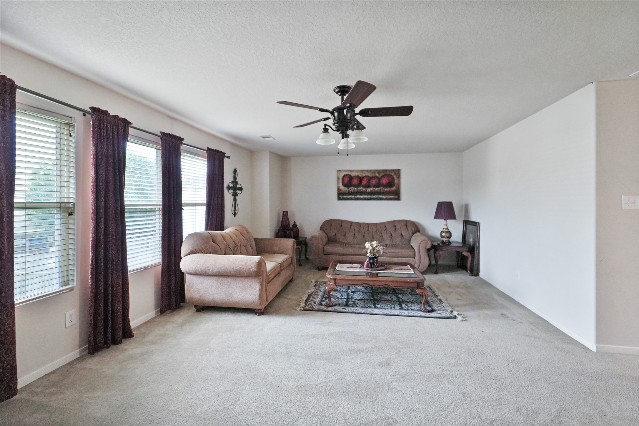 8011 Sumal Circle Baytown, TX 77521 - Photo 21 of 37 a living room with furniture and a chandelier