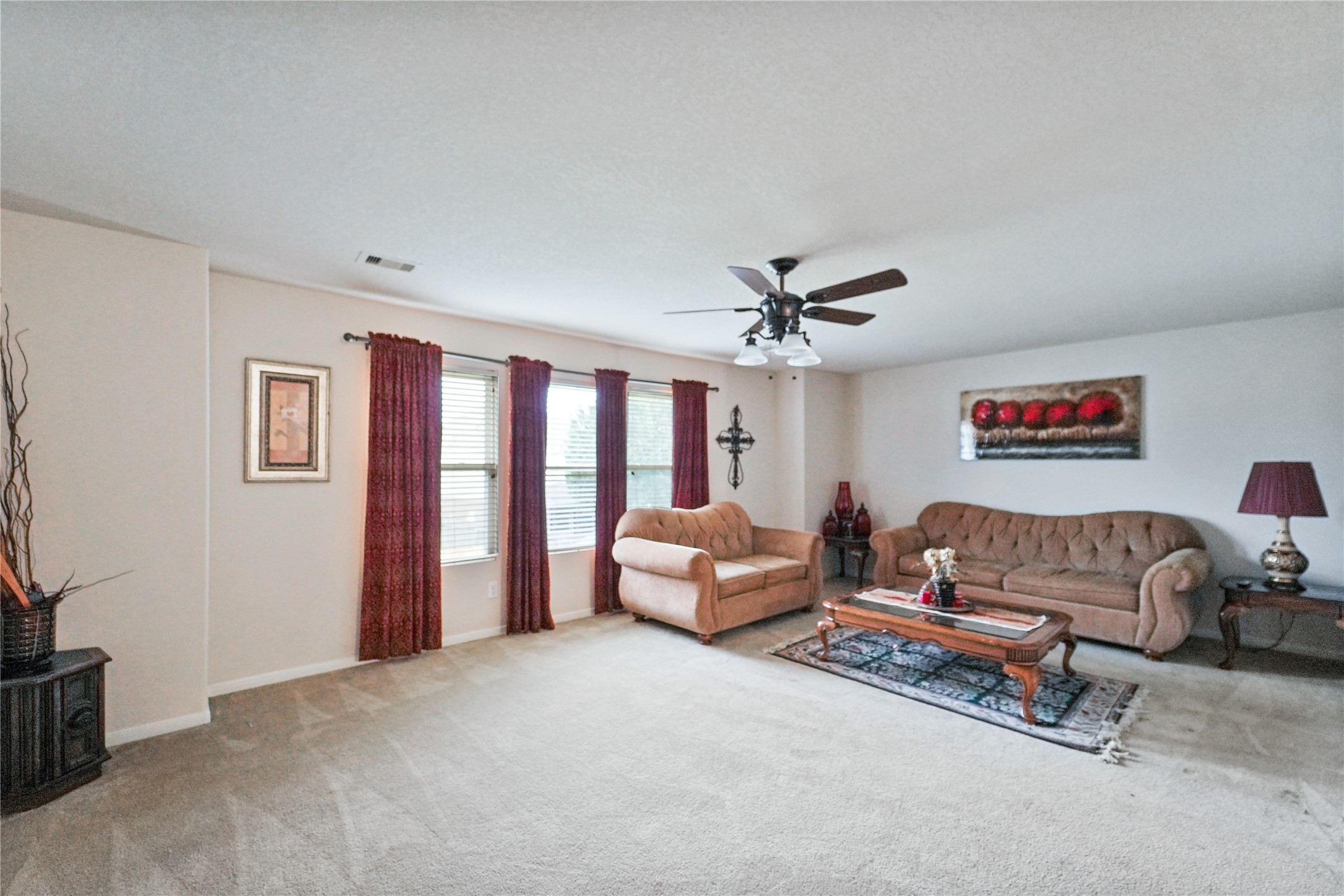 8011 Sumal Circle Baytown, TX 77521 - Photo 22 of 37 a living room with furniture and a ceiling fan
