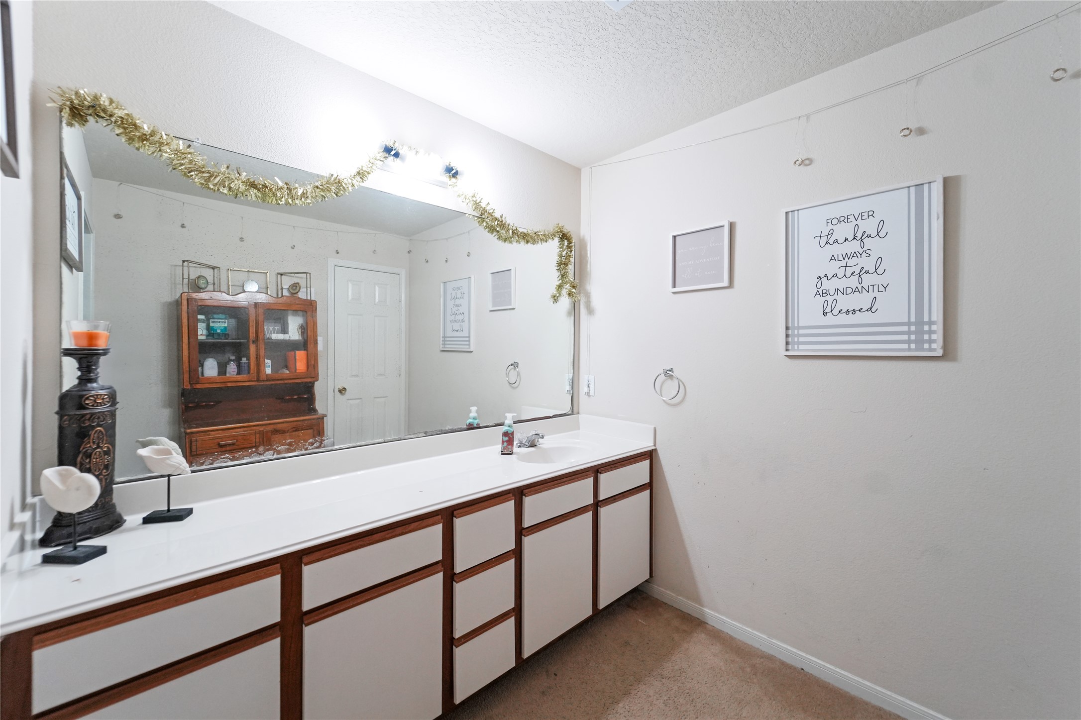 8011 Sumal Circle Baytown, TX 77521 - Photo 26 of 37 a bathroom with a sink and a mirror