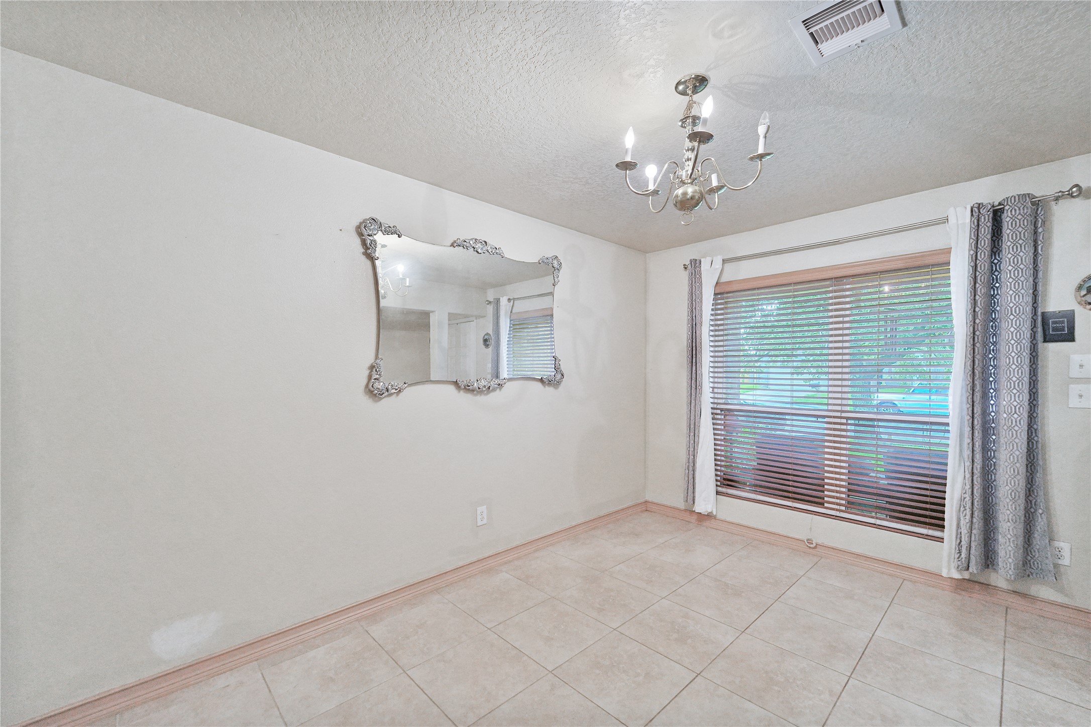 8011 Sumal Circle Baytown, TX 77521 - Photo 3 of 37 a view of an empty room with a window
