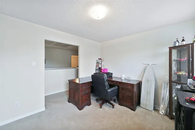 a workspace with furniture and a chandelier