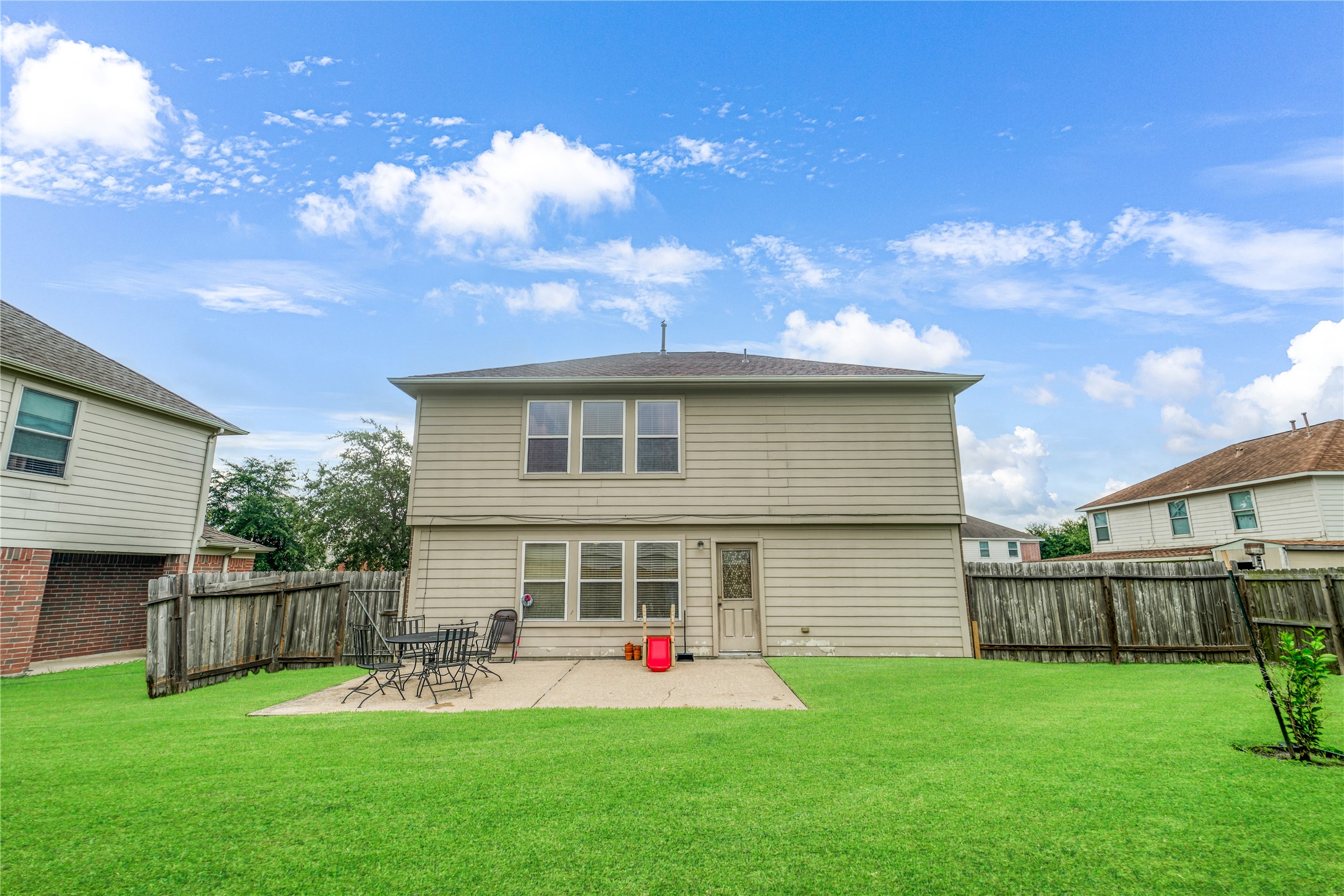 8011 Sumal Circle Baytown, TX 77521 - Photo 37 of 37 a front view of a house with a yard and deck