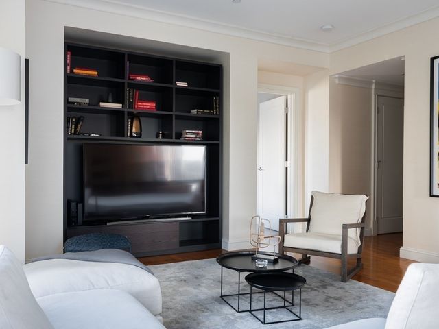 a living room with a couch and a flat screen tv