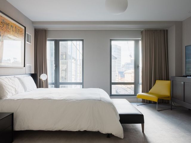 a bedroom with a bed and a couch