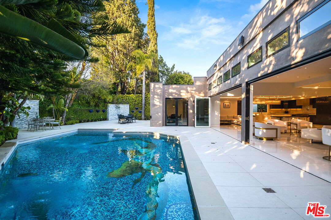 16601 Park Ln Circle Los Angeles, CA 90049 - Photo 19 of 69 a view of yard with patio