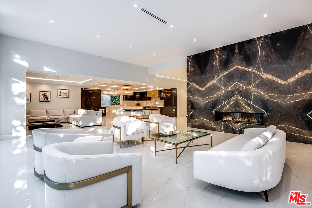 16601 Park Ln Circle Los Angeles, CA 90049 - Photo 26 of 69 a living room with furniture and kitchen view