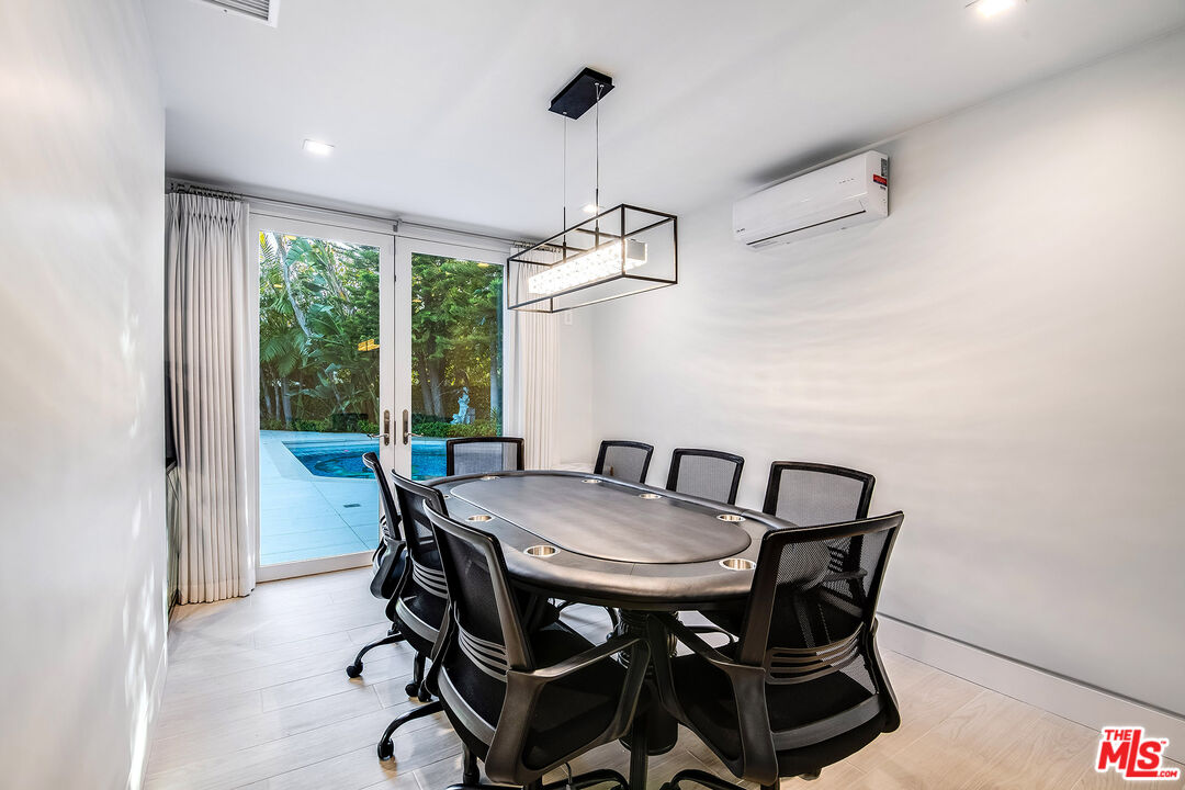 16601 Park Ln Circle Los Angeles, CA 90049 - Photo 46 of 69 a view of a dining room with furniture window and outside view