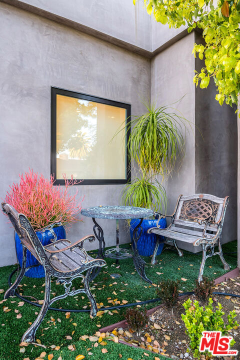16601 Park Ln Circle Los Angeles, CA 90049 - Photo 50 of 69 a outdoor living room with furniture