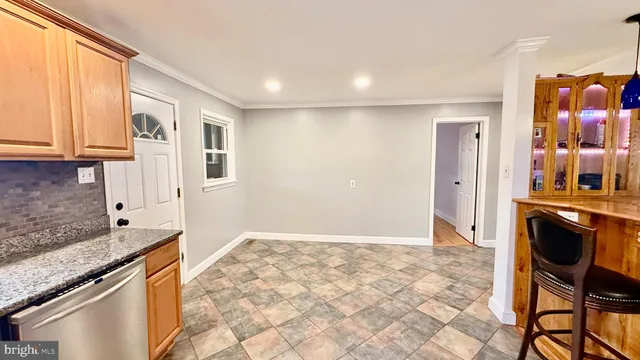 a view of a kitchen cabinets and wooden floor
