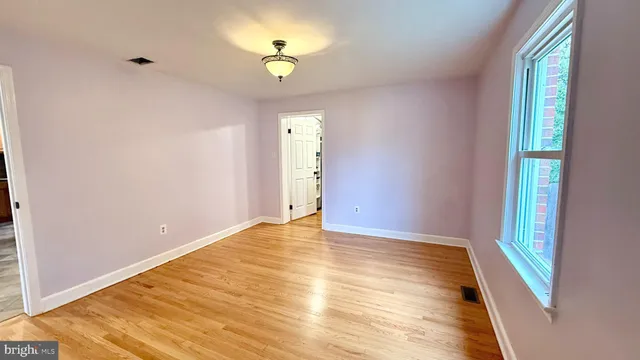 a view of an empty room and window