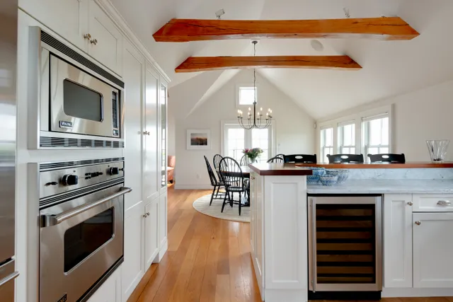 a kitchen with stainless steel appliances granite countertop a stove and a refrigerator