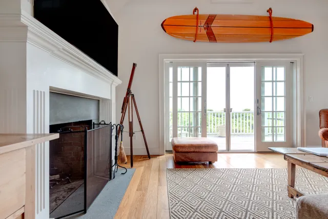 a bedroom with furniture and large window