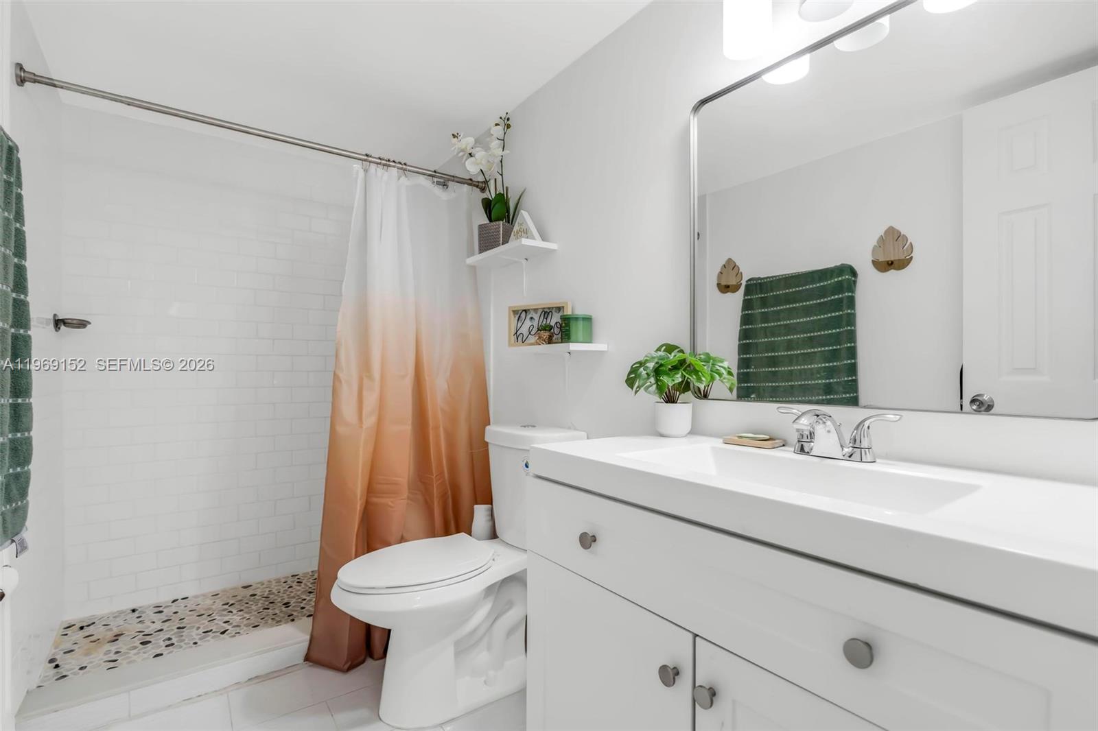 8501 Northwest 8th Street, Unit 110 Miami, FL 33126 - Photo 13 of 21 a bathroom with a sink a toilet and shower