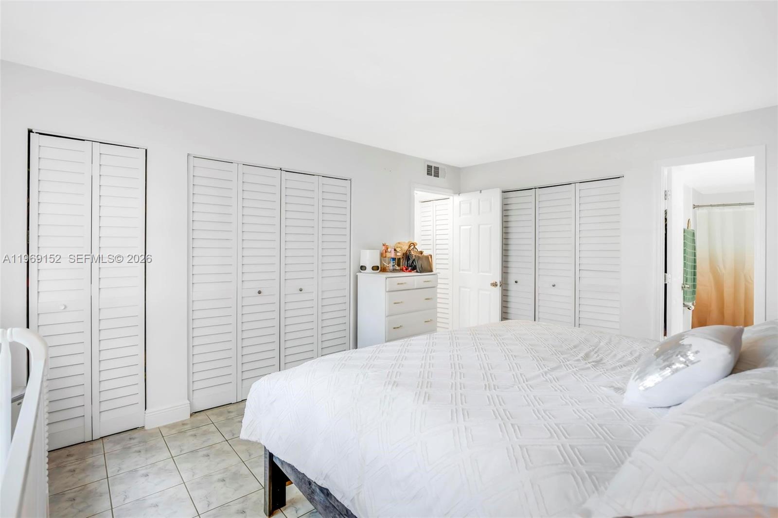 8501 Northwest 8th Street, Unit 110 Miami, FL 33126 - Photo 14 of 21 a large white bed in a white room