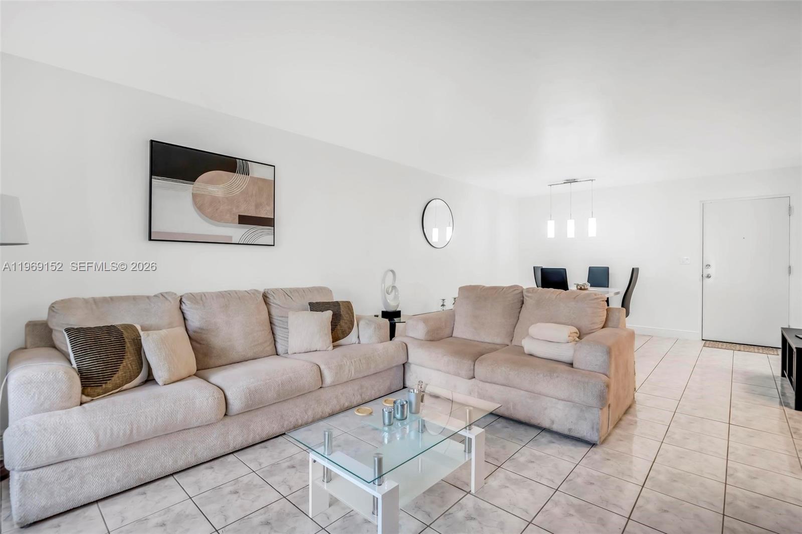 8501 Northwest 8th Street, Unit 110 Miami, FL 33126 - Photo 16 of 21 a living room with furniture and a couch