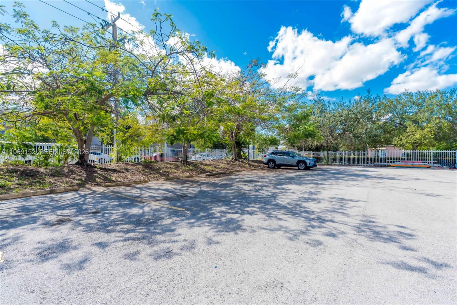 8501 Northwest 8th Street, Unit 110 Miami, FL 33126 - Photo 21 of 21 a car parked on the side of the road