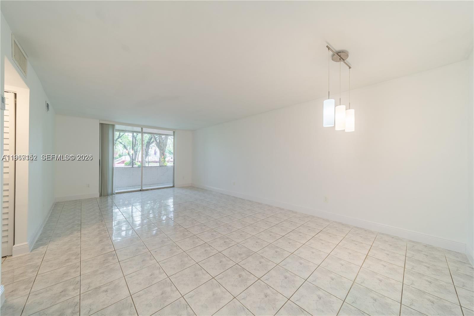 8501 Northwest 8th Street, Unit 110 Miami, FL 33126 - Photo 8 of 21 an empty room with windows and closet
