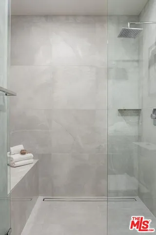 a bathroom with a bathtub and shower