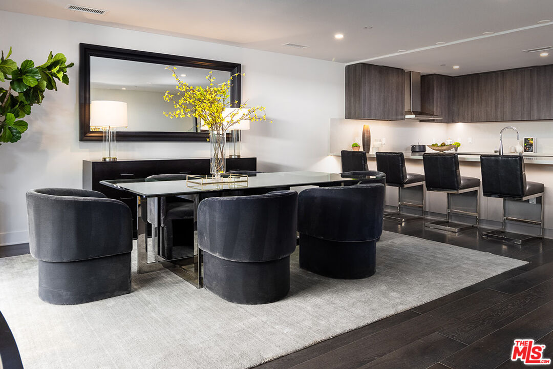 411 South Hamel Road, Unit 205 Los Angeles, CA 90048 - Photo 2 of 17 a kitchen with stainless steel appliances granite countertop a sink a stove and a refrigerator