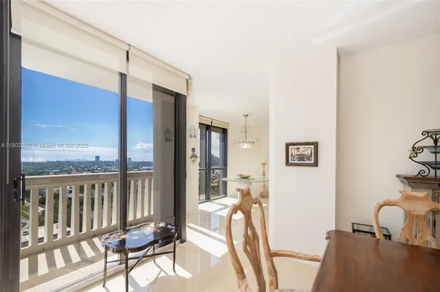 a view of a balcony with furniture and a window
