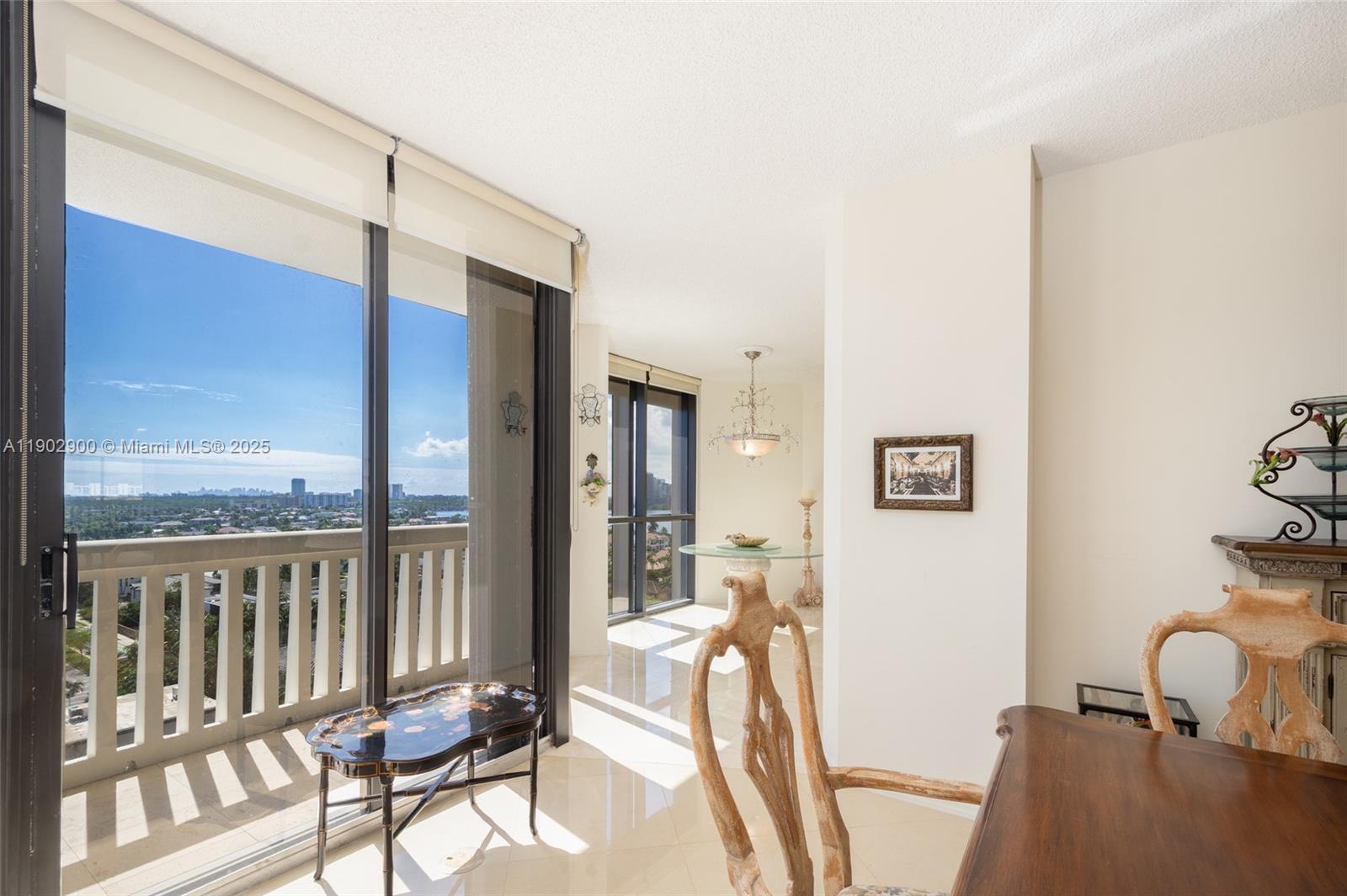 2000 Island Boulevard, Unit 1109 Aventura, FL 33160 - Photo 1 of 13 a view of a balcony with furniture and a window