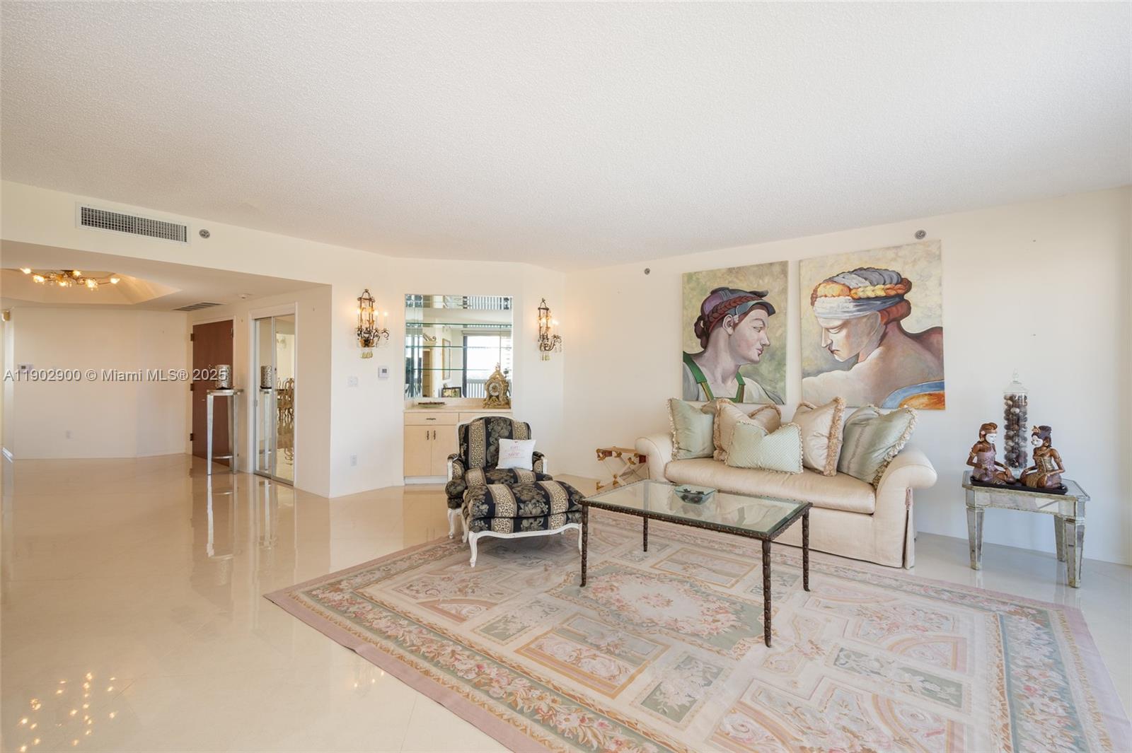 2000 Island Boulevard, Unit 1109 Aventura, FL 33160 - Photo 5 of 13 a living room with furniture and a table