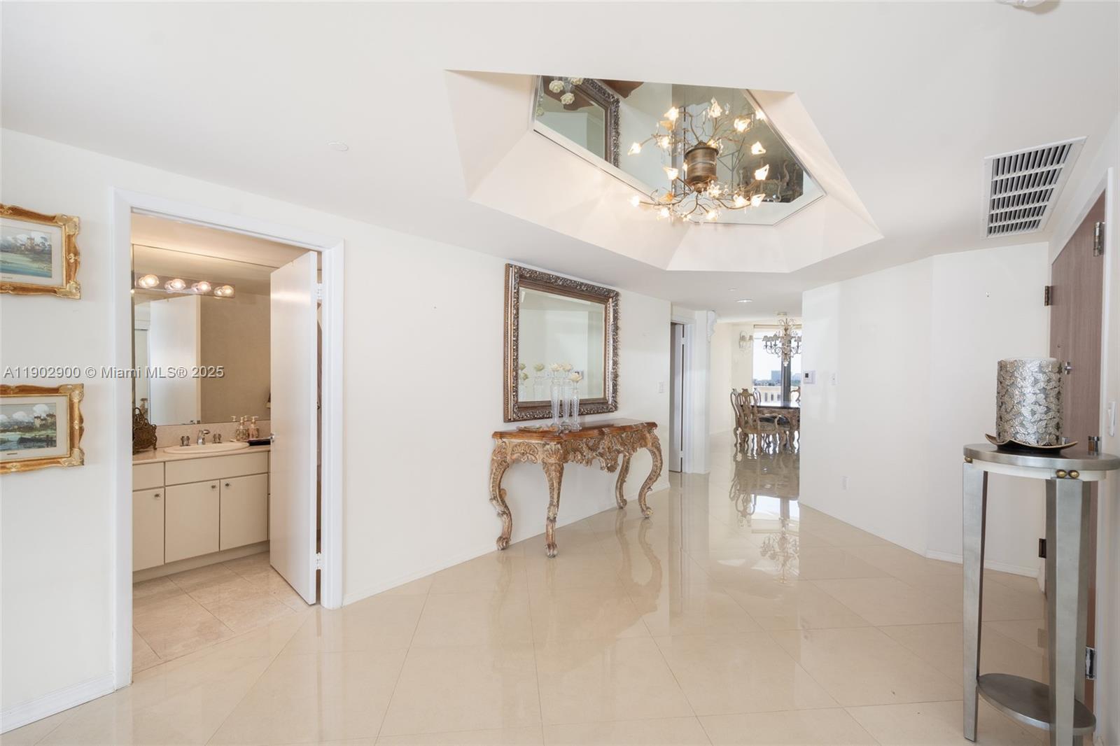 2000 Island Boulevard, Unit 1109 Aventura, FL 33160 - Photo 6 of 13 a view of a livingroom with furniture and a kitchen