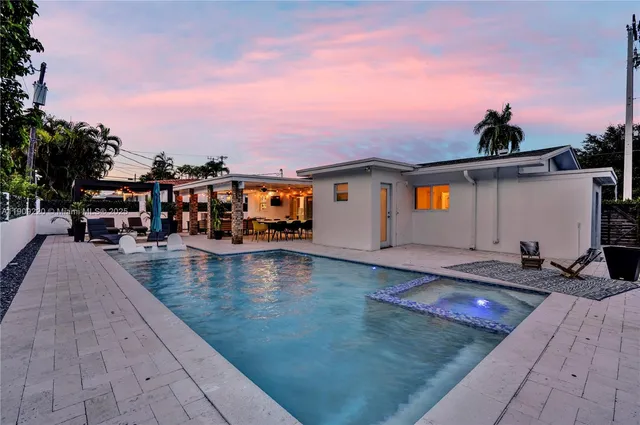 a view of a swimming pool with lounge chair