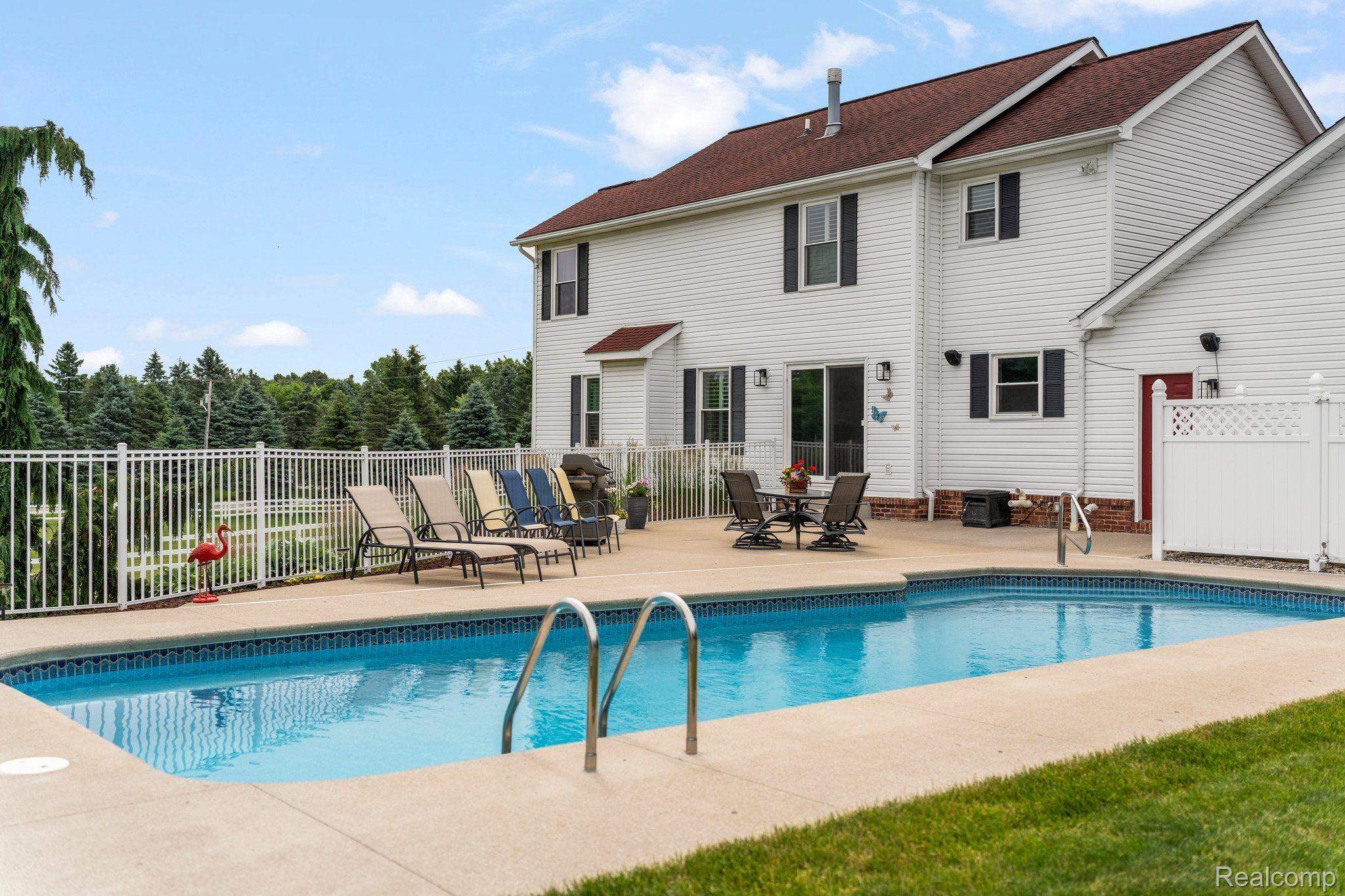 3310 Middle Road Highland, MI 48357 - Photo 11 of 45 and door-wall to fenced in patio and pool area