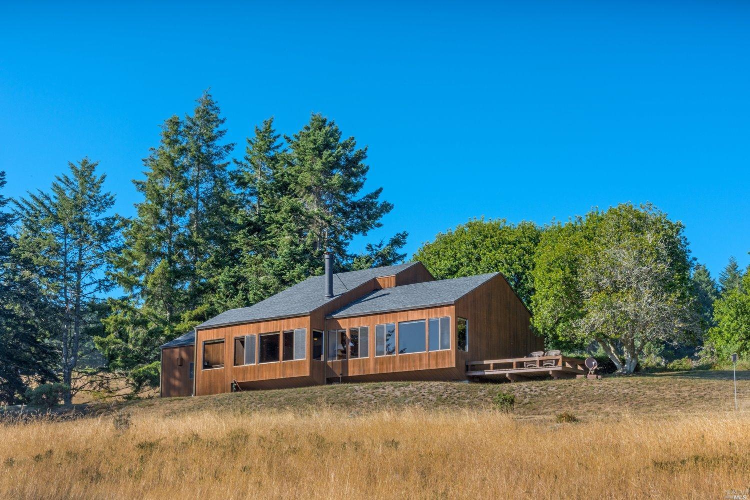 36115 Sea Ridge Road The Sea Ranch, CA 95497 - Photo 1 of 1 a house that has a tree in it