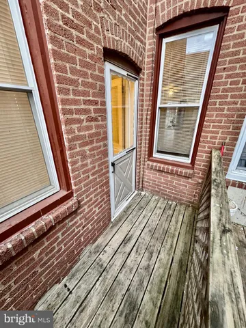a view of an empty room with stairs