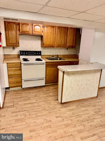 a white toilet sitting next to a bathroom