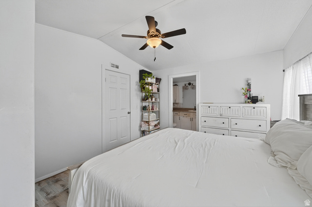 160 Cushing Way Layton, UT 84041 - Photo 17 of 23 Bedroom featuring light wood-finish flooring and a ceiling fan with integrated lighting