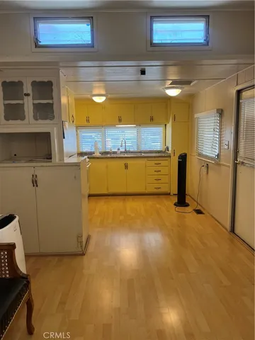a view of a room with a fridge