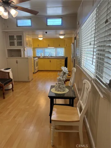 a view of a room with furniture and window