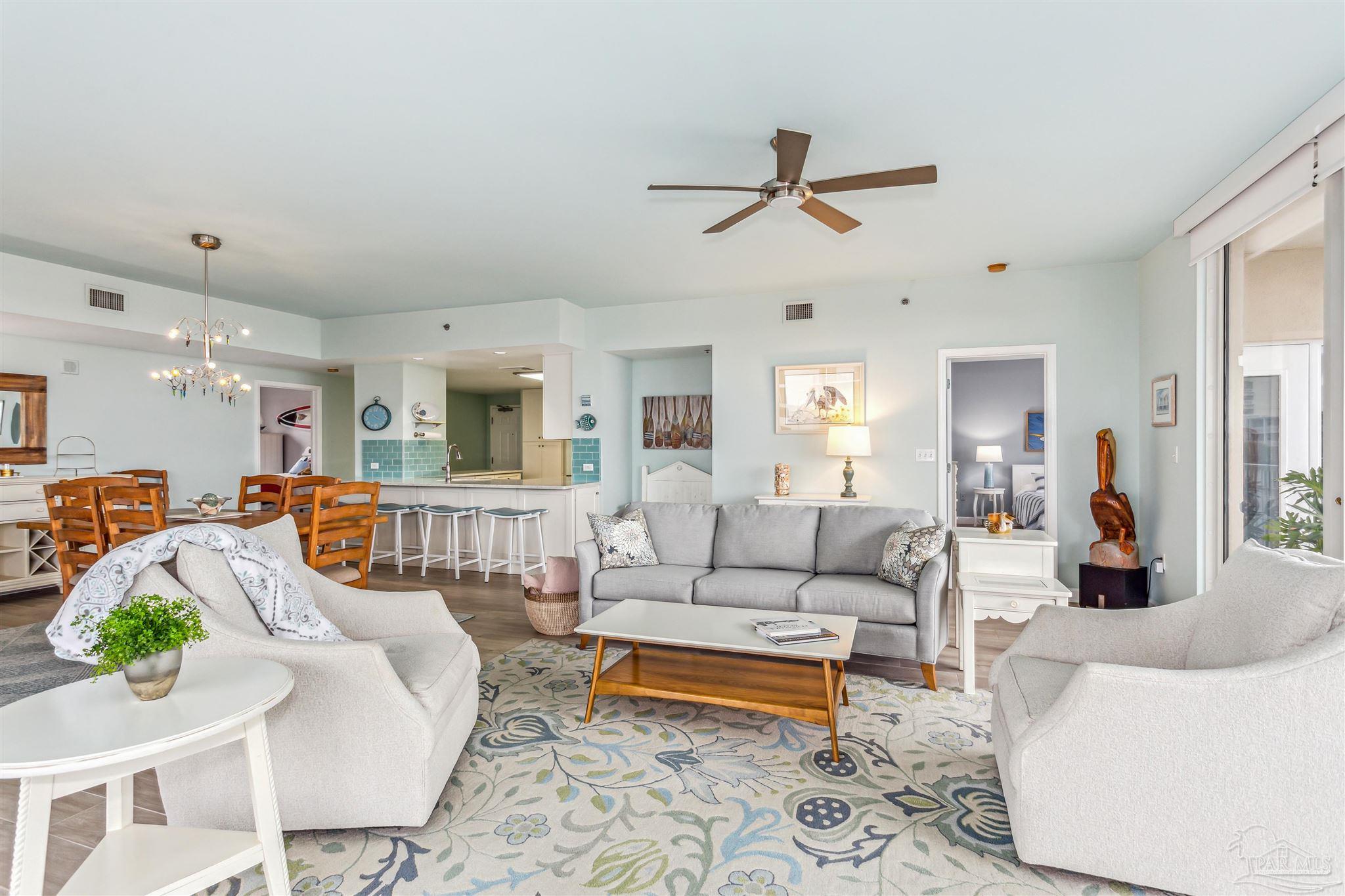800 Fort Pickens Road, Unit 204 Pensacola Beach, FL 32561 - Photo 11 of 45 a living room with furniture and a wooden floor