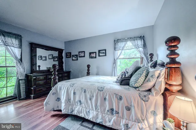 a bed room with two beds and a window