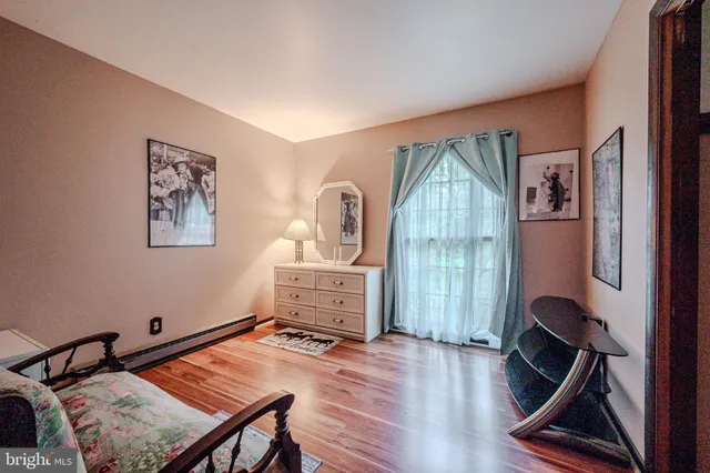 a room with furniture and wooden floor