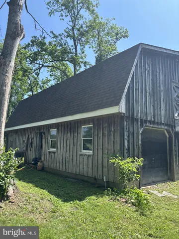 a view of outdoor space with wooden floor