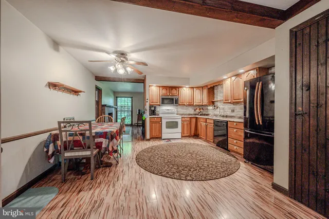 a kitchen with a refrigerator stove and oven