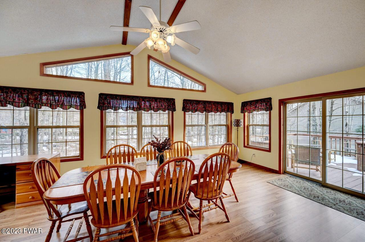 413 Northgate Road Lake Ariel, PA 18436 - Photo 13 of 59 a view of a dining room with furniture window and wooden floor