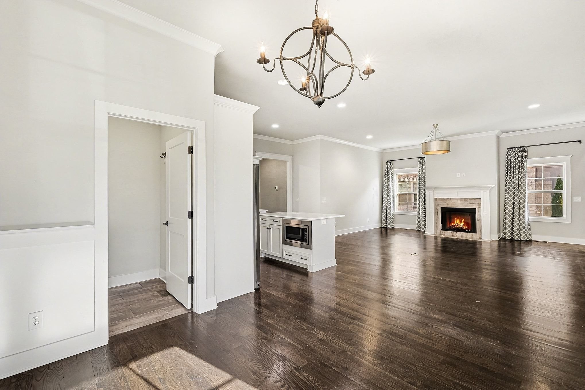 3008 Turnstone Trace Spring Hill, TN 37174 - Photo 11 of 30 a view of a livingroom with wooden floor and a kitchen space